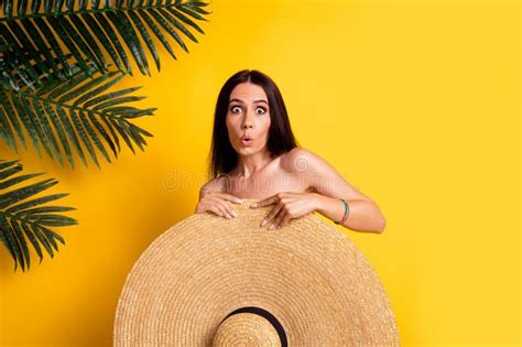 Photo Of Pretty Impressed Lady Wear Bikini Hiding Behind Big Sun Hat Empty Space Isolated Yellow