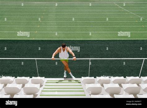 Athlete Doing Warm Up Exercise On Running Track Stock Photo Alamy