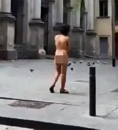 Sinister Moment Naked Woman Walks Out Of A Public Toilet In Barcelona Before Being Shoved Back