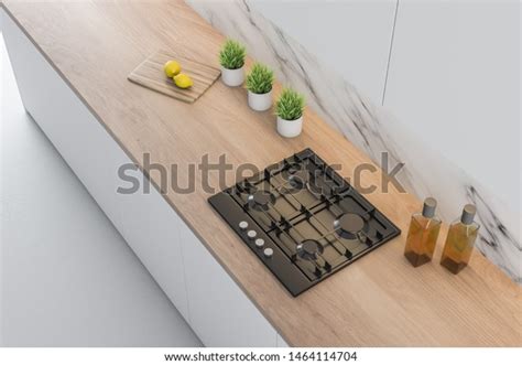 Top View Of Kitchen Countertop With Built In Cooker Cutting Board And