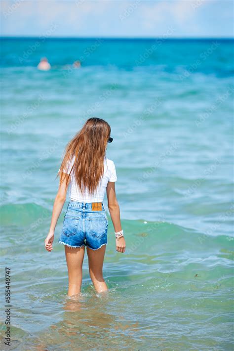 Adorable teen girl on the beach enjoy her summer vacation Stock Photo