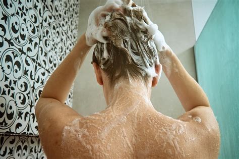 Premium Photo Back View Of Naked Woman Taking Shower In Shower Stall