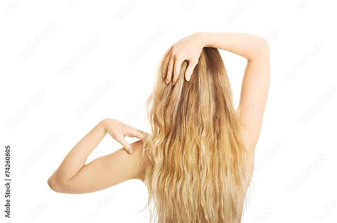 Back View Of Naked Woman Touching Her Shoulder Stock Photo Adobe Stock