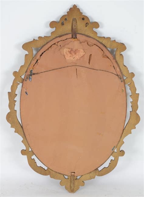 Early 20th Century Oval Wall Mirror In Carved Wood Frame Ebth