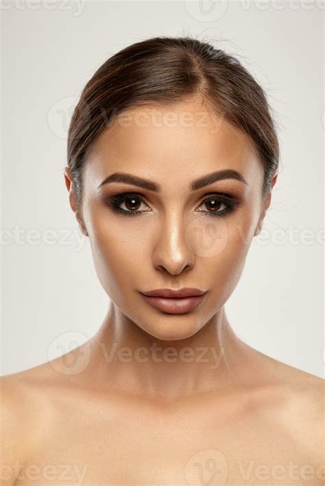 Close Up Portrait Of A Brunette Nude Model Girl With Professional Evening Make Up And Plump Lips