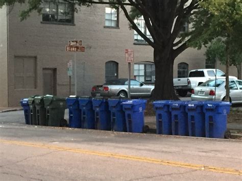 Line Of Garbage And Recycling Containers At Curb Issue 1980740