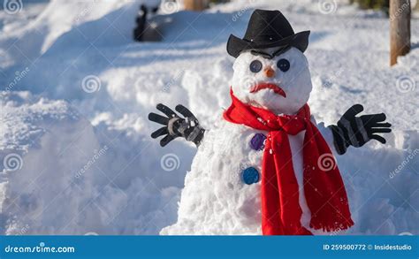 A Snowman With A Creepy Grimace In A Hat And Scarf Stock Photo Image