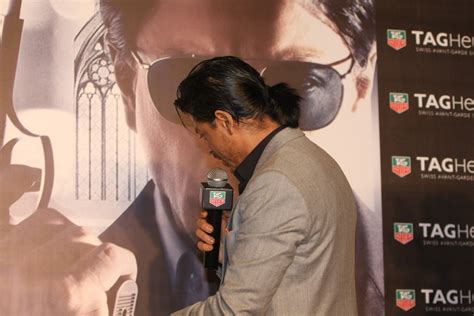 Shah Rukh Khan pony tail : rediff bollywood photos on Rediff Pages