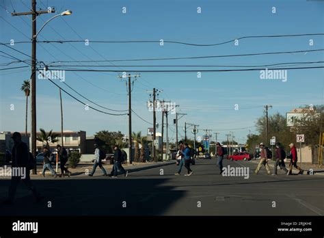 San Luis, Arizona, USA - January 3, 2022: People walk near the USA and ...