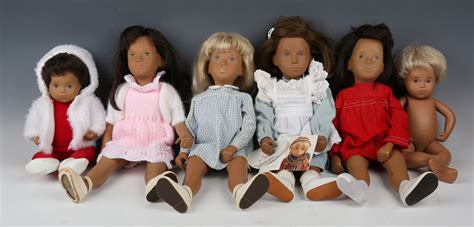 A Sasha Vinyl Doll With Blonde Hair And Painted Blue Eyes Wearing A Blue Gingham Outfit Height C