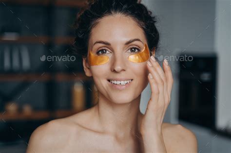 Face Of Young Woman Which Applies Collagen Eye Patches Portrait Of