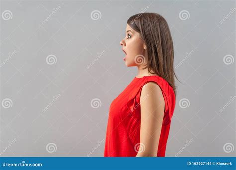 Profile Side View Portrait Of Shocked Beautiful Brunette Young Woman In