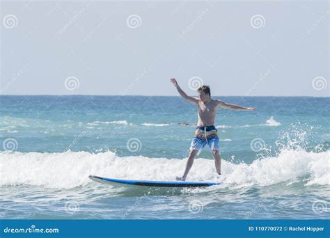 Young Man Learning To Surf In Mexico Stock Photo Image Of Happy