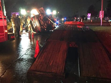 Firefighters Extricate Driver From Car That Flipped After Hitting Ramp On Parked Flatbed