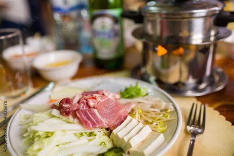 Plate Of Ingredients For Korean Hot Pot Pork Belly Tofu Bean Sprout