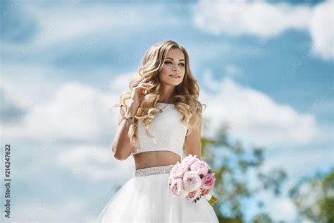 Beautiful And Sensual Blonde Model Girl With Sexy Body In Stylish Tulle Skirt And In Fashionable