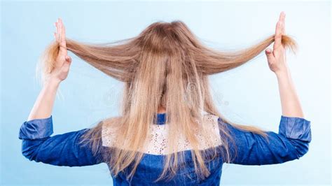 Blonde Woman Playing With Hair Stock Photo Image Of Girl Haircare
