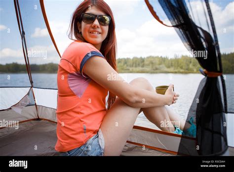 Photo Of Brunette In Sunglasses Sitting Inside Tent On Riverbank On Summer Day Stock Photo Alamy