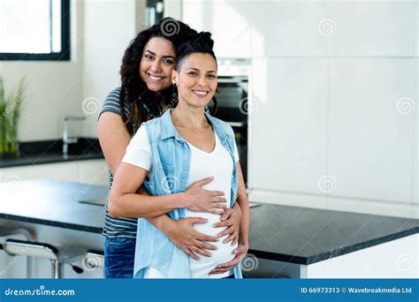 Pregnant Lesbian Couple Standing Back To Back Royalty Free Stock Photography CartoonDealer