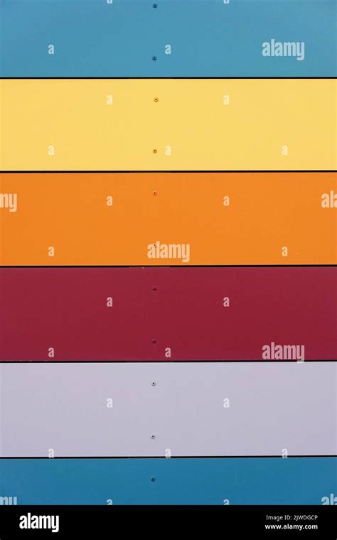 multicolored wall cladding background with horizontal panels Stock