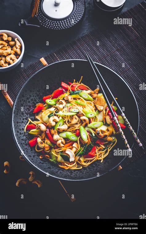 Stir Fry Noodles With Chicken Vegetables And Roasted Cashew Nuts Stock