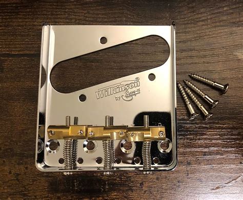 Left handed Wilkinson Telecaster Bridge w/brass saddles | Reverb