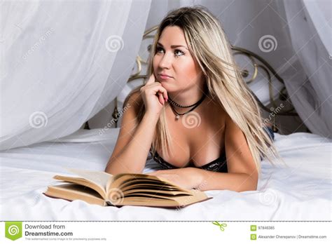 Blonde Woman Lying In Bed In Bright Room And Reading A Book Stock Image Image Of Beautiful