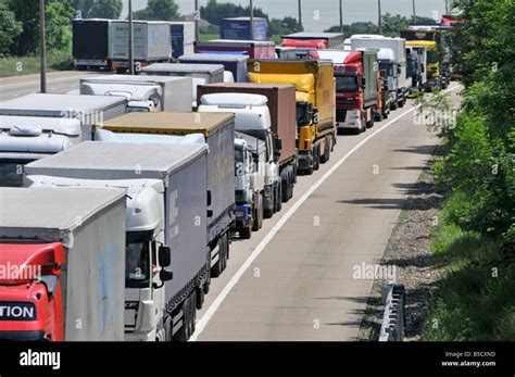 M25 motorway long queue of trucks gridlocked in traffic jam Stock Photo ...