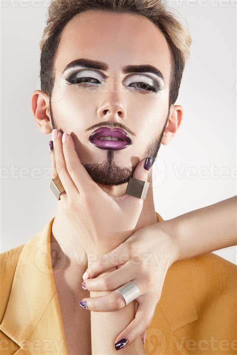 Fashionable Gay Model With Beard And Magenta Makeup Stock Photo At Vecteezy