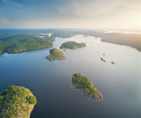 Premium Photo | Island on lake during sunset aerial view