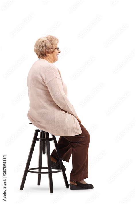 Senior Woman Sitting On A Stool Chair And Posing Stock Foto Adobe Stock