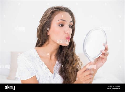 Attractive Brunette Posing In Front Of Mirror Stock Photo Alamy