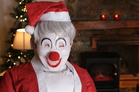 Weird Looking Clown Dressed As Santa Claus For Christmas Time Stock