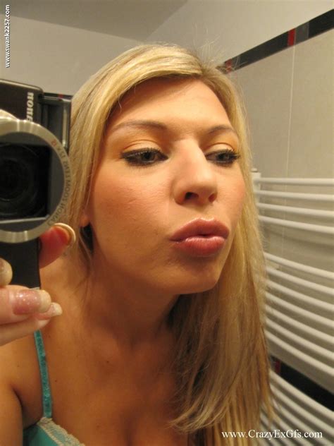 Blonde With Small Boobs Kristi Lust Poses In Front Of A Mirror While Stripping CoedCherry