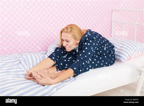 Mature Woman Stretching In Bed Hi Res Stock Photography And Images Alamy