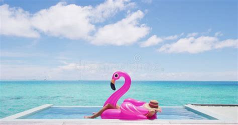 Travel Vacation Holidays Concept Woman In Pool By Beach Sunbathing In Bikini In Inflatable Pink