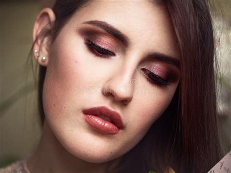 Beautiful Brunette Woman Face Closeup Beauty Eyes And Lips Makeup Moody Female Portrait Stock