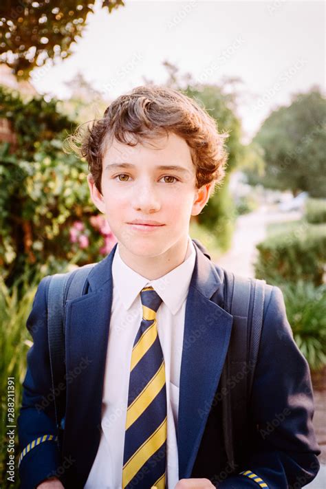 Teenage Boy In A School Uniform With Backpack Stock Photo Adobe Stock