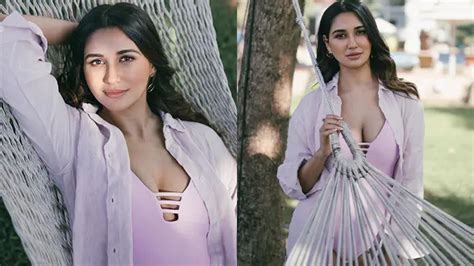 Hot Nikita Dutta Showcased Her Big Boobs And Curvy Figure In Purple Monokini With A Breezy Shirt