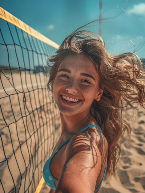 A Woman Wearing A Bikini Stands By A Volleyball Net On A Sunny Beach