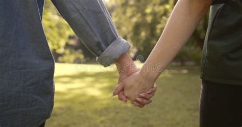 Lesbian Couple Walking In Park Holding Hands Stock Footage Video Of Lady Looking