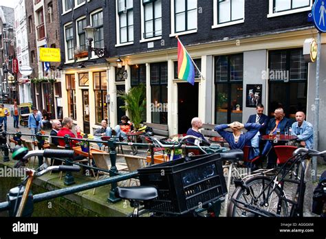 Men Sitting Outside A Gay Bar On The Red Light District Amsterdam Stock Photo Alamy