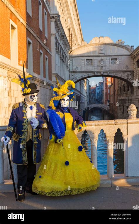 Carnival Goers Dressed In Splendid Costumes And Masks During Venice