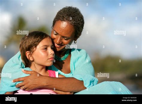 Mature Woman Hugging Her Granddaughter Stock Photo Alamy