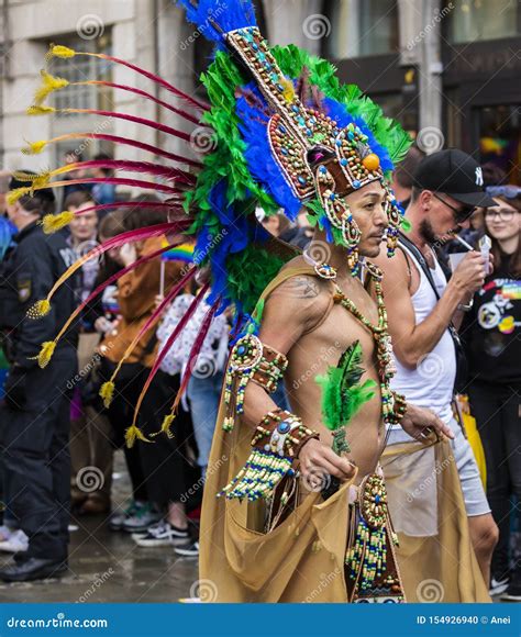 A Man Wearing An Elaborate Aztec Dress Attending The Gay Pride Parade Also Known As Christopher