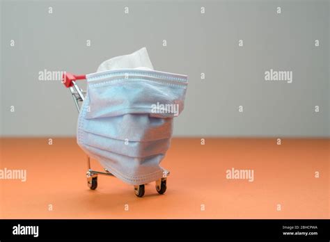 Shopping Cart Or Trolley With Medical Face Mask Wrapped Around It