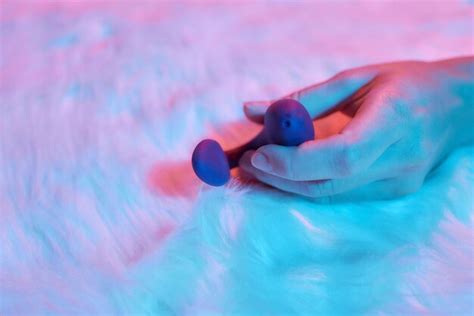 Premium Photo Desire Concept Woman Lying In Bed Holding A Dildo Vibrator In Her Hand To Help