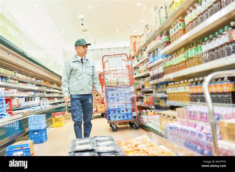 Senior Man Manager In Supermarket Restock Stock Photo Alamy