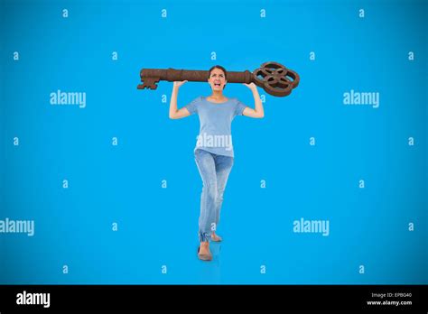 Annoyed Brunette Carrying Large Key Against Road Leading Out To The Horizon With Light Beam