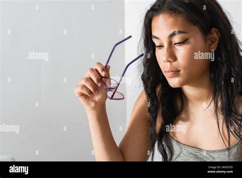 Beautiful Brunette Woman Doing Her Chores And Homework Looking Attentively While Holding Her